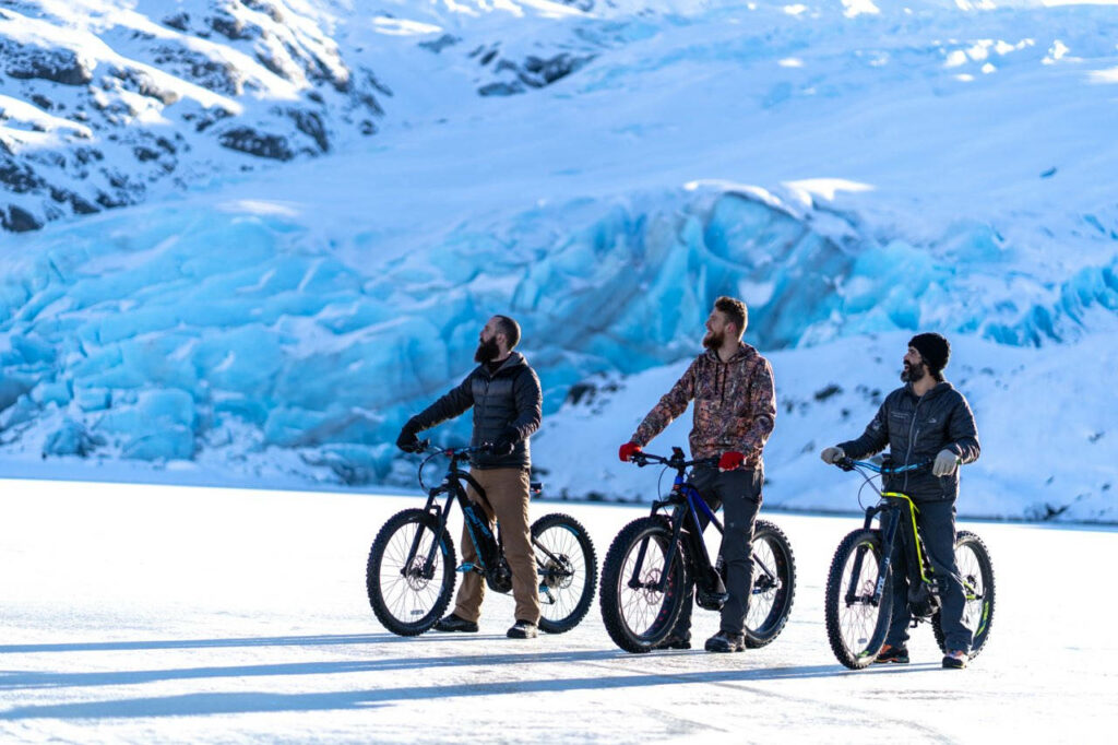 image of mountain bikers in the snow